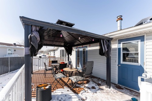 The property features a private deck with a dark-colored gazebo, providing an outdoor living space - 1663 Jubilee Crescent, Sherwood Park, AB - Outdoor With Deck Patio Veranda With Exterior