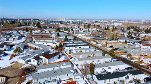 Aerial view of a residential neighbourhood with a clear blue sky - 1663 Jubilee Crescent, Sherwood Park, AB - Outdoor With View