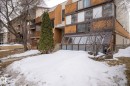 The property features a multi-story exterior with horizontal wood paneling and large windows, offering ample natural light - 2 9140 149 Street, Edmonton, AB  - Outdoor 