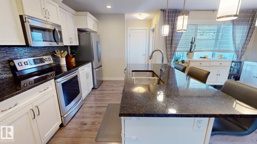 30 Sierra Wynd, Fort Saskatchewan, AB - Indoor Photo Showing Kitchen With Stainless Steel Kitchen With Double Sink With Upgraded Kitchen