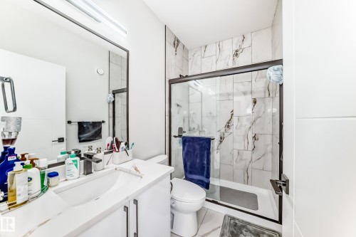 Bathroom featuring a contemporary vanity with a white countertop and rectangular undermount sink - 17459 80 Street, Edmonton, AB - Indoor Photo Showing Bathroom