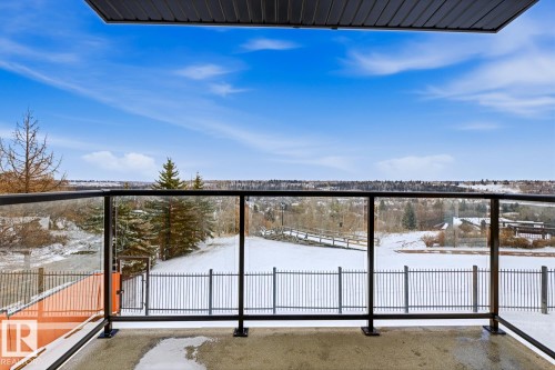 Private balcony with glass railing and durable concrete flooring - 115 10105 95 Street, Edmonton, AB - Outdoor With Balcony With View