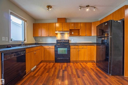 #51, 2503 24 Street, Edmonton, AB - Indoor Photo Showing Kitchen With Double Sink
