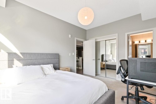 Bedroom featuring light-colored walls and carpeted flooring - 406 10811 72 Avenue, Edmonton, AB - Indoor Photo Showing Bedroom