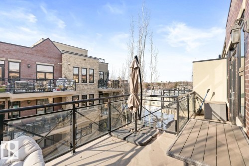 This property features an outdoor patio area with a glass and metal railing, offering open sky views - 406 10811 72 Avenue, Edmonton, AB - Outdoor With Balcony With Exterior