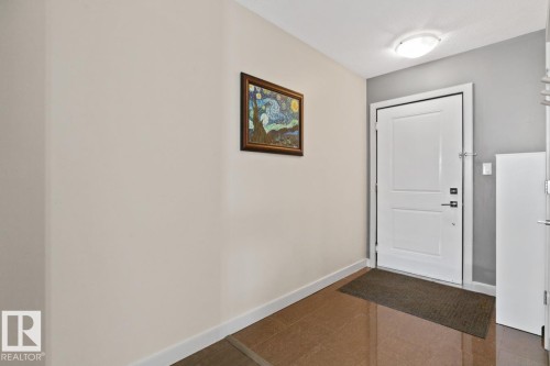 Entryway featuring a white door, a flush mount ceiling light, and tiled flooring - 406 10811 72 Avenue, Edmonton, AB - Indoor Photo Showing Other Room