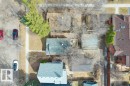 Aerial perspective showcasing multiple properties with varied rooflines and surrounding mature deciduous trees - 12207 110 Avenue, Edmonton, AB  - Outdoor 