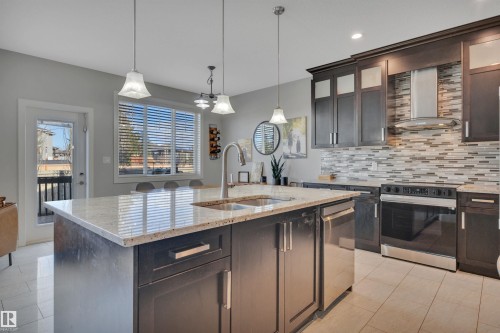 41 Sutherland Street, Leduc, AB - Indoor Photo Showing Kitchen With Double Sink With Upgraded Kitchen