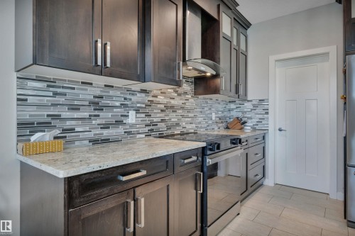 41 Sutherland Street, Leduc, AB - Indoor Photo Showing Kitchen With Upgraded Kitchen