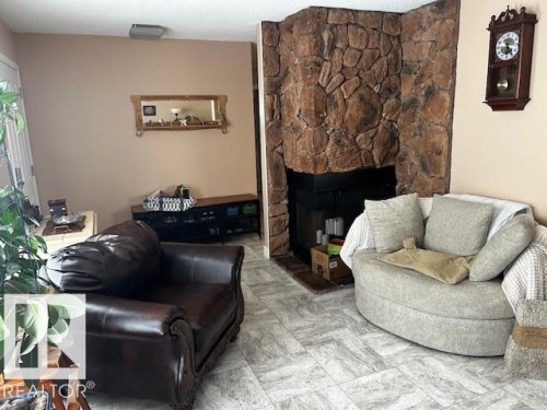 4611 50A Avenue, Lamont, AB - Indoor Photo Showing Living Room With Fireplace