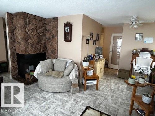 4611 50A Avenue, Lamont, AB - Indoor Photo Showing Living Room With Fireplace