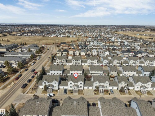 Aerial perspective showcasing a residential community with a consistent architectural style - 48 2503 24 Street, Edmonton, AB - Outdoor With View