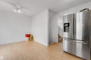 Open-concept room featuring light wood-finish flooring and a ceiling fan - 48 2503 24 Street, Edmonton, AB  - Indoor 