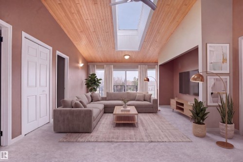 The living area features a vaulted wood-paneled ceiling with a skylight, light-colored walls, and a large window providing views of the outdoors - 10815 Bearspaw Dr E Nw, Edmonton, AB - Indoor