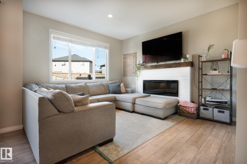 1245 Mcconachie Boulevard, Edmonton, AB - Indoor Photo Showing Living Room With Fireplace