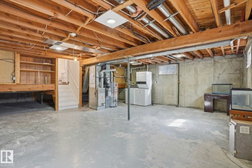 Unfinished basement featuring exposed wood joists and concrete walls - 15811 114 Street, Edmonton, AB - Indoor Photo Showing Basement