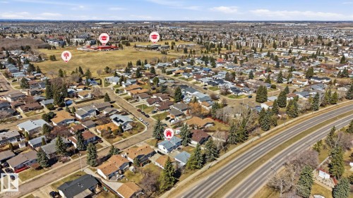 Aerial view of a residential neighborhood with established homes, tree-lined streets, and open green spaces - 15811 114 Street, Edmonton, AB - Outdoor With View