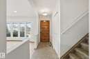 Entryway featuring a wood-panel door, tile flooring, recessed lighting, and a bay window - 15811 114 Street, Edmonton, AB  - Indoor Photo Showing Other Room 