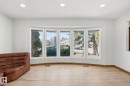 Bay window with multiple large panes, overhead recessed lighting, and light wood-finish flooring - 15811 114 Street, Edmonton, AB  - Indoor 