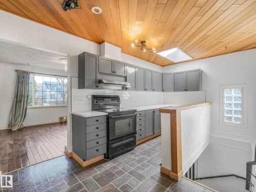 Kitchen with wood-finish ceiling, skylight, and recessed lighting - 11643 76 Avenue, Edmonton, AB - Indoor Photo Showing Kitchen