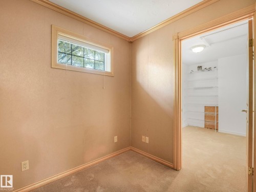 Interior room with neutral-toned walls, cream-colored trim, and carpet flooring - 11643 76 Avenue, Edmonton, AB - Indoor Photo Showing Other Room