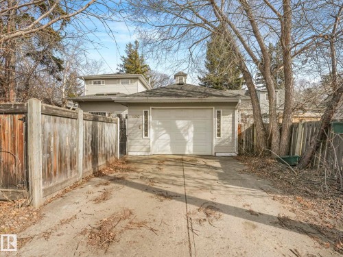 Attached garage with a white overhead door and cupola feature - 11643 76 Avenue, Edmonton, AB - Outdoor