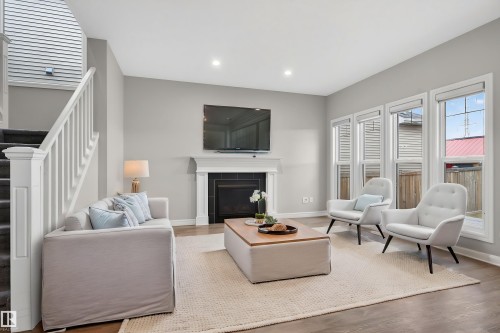 8825 24 Avenue, Edmonton, AB - Indoor Photo Showing Living Room With Fireplace