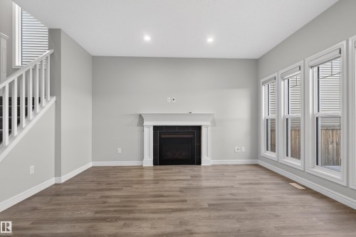 8825 24 Avenue, Edmonton, AB - Indoor Photo Showing Living Room With Fireplace