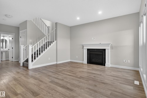 8825 24 Avenue, Edmonton, AB - Indoor Photo Showing Living Room With Fireplace
