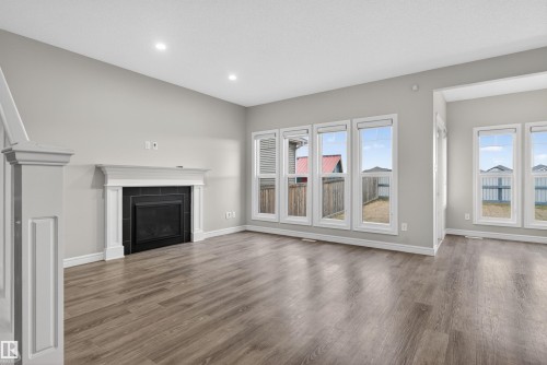 8825 24 Avenue, Edmonton, AB - Indoor Photo Showing Living Room With Fireplace