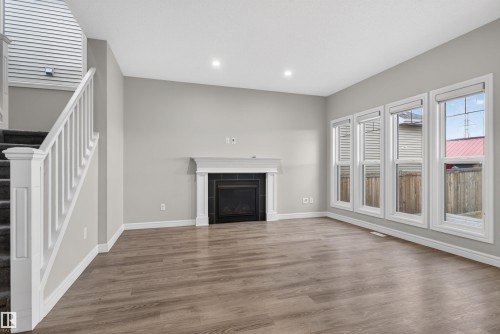8825 24 Avenue, Edmonton, AB - Indoor Photo Showing Living Room With Fireplace