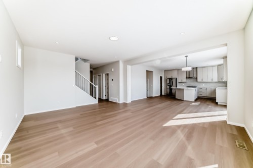 This property features open concept living with light wood floors and recessed lighting - 1516 206 Street Nw, Edmonton, AB - Indoor