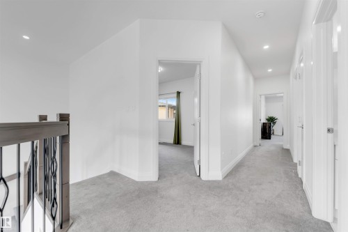 Upper-level hallway with light gray carpet flooring and recessed lighting - 1923 19 Avenue, Edmonton, AB - Indoor Photo Showing Other Room