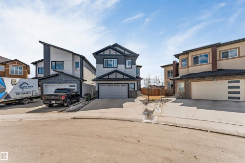 Modern two-story home featuring a striking dark gray and light gray exterior with contrasting black trim - 1923 19 Avenue, Edmonton, AB - Outdoor With Facade