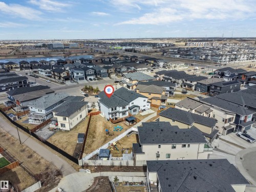 Two-story residence featuring a light-colored exterior and a dark shingle roof - 1923 19 Avenue, Edmonton, AB - Outdoor With View