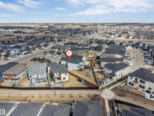 Modern suburban residence featuring a two-story design, attached garage, private backyard space, and proximity to neighborhood streets - 1923 19 Avenue, Edmonton, AB - Outdoor With View