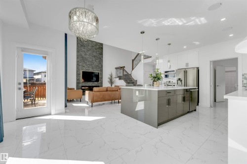 Open-concept living space featuring high ceilings and large format tile flooring - 1923 19 Avenue, Edmonton, AB - Indoor Photo Showing Kitchen