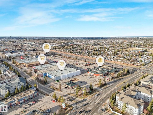 Aerial perspective showcasing a commercial development amidst an expansive suburban landscape - 23 9731 174 Street, Edmonton, AB - Outdoor With View