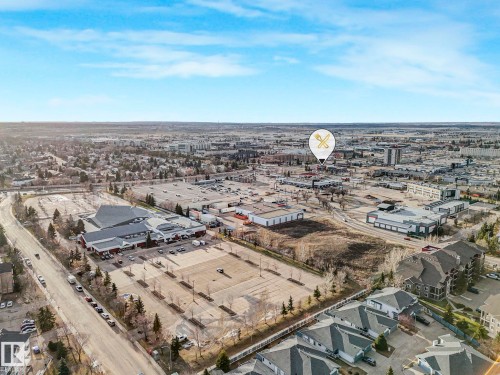 Aerial perspective showcasing a mixed-use urban landscape with commercial and residential structures - 23 9731 174 Street, Edmonton, AB - Outdoor With View