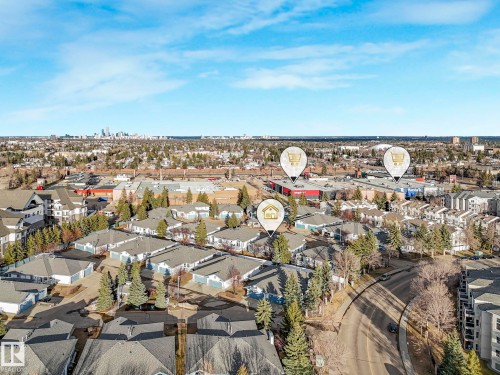 Aerial perspective showcasing a residential area with varied rooflines and surrounding green spaces - 23 9731 174 Street, Edmonton, AB - Outdoor With View