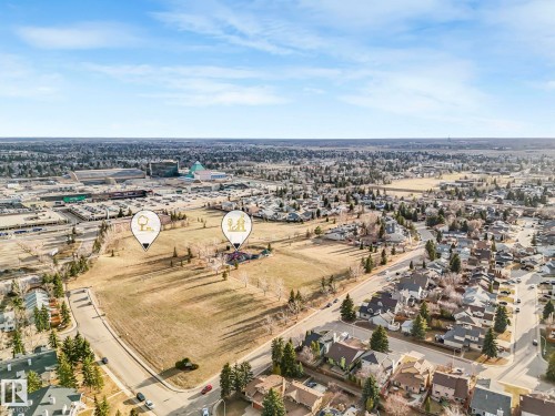 Expansive residential area featuring a mix of detached homes and undeveloped land - 23 9731 174 Street, Edmonton, AB - Outdoor With View