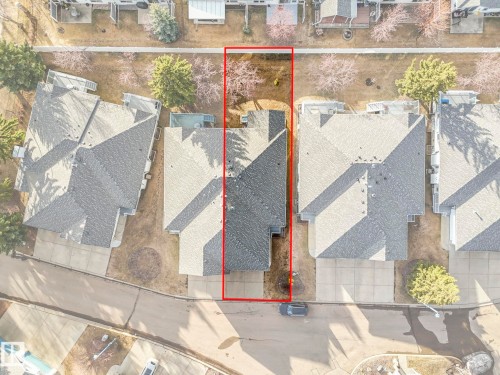 Overhead property view featuring a gabled roofline, front-facing driveway, and a treed backyard space - 23 9731 174 Street, Edmonton, AB - Outdoor