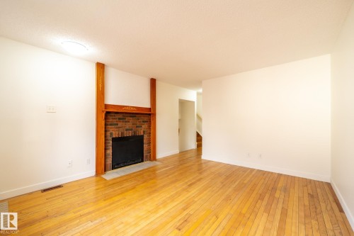 744 Saddleback Road, Edmonton, AB - Indoor Photo Showing Other Room With Fireplace