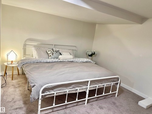 Bedroom featuring light-colored walls and grey carpeting - 11681 72 Avenue, Edmonton, AB - Indoor Photo Showing Bedroom