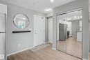 Entryway featuring wood-finish flooring, light grey walls, and a recessed ceiling light fixture - 217 394 Windermere Road, Edmonton, AB  - Indoor Photo Showing Other Room 