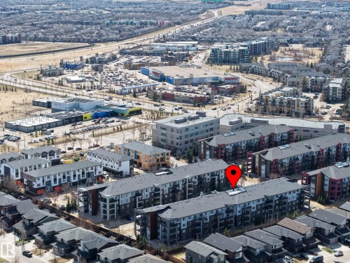Modern multi-story residential building with grey roofing and dark-toned exterior finishes - 217 394 Windermere Road, Edmonton, AB - Outdoor With View
