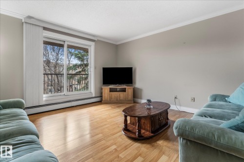308 10520 80 Avenue, Edmonton, AB - Indoor Photo Showing Living Room