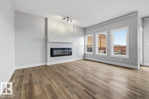 88 Tribute Common, Spruce Grove, AB - Indoor Photo Showing Living Room With Fireplace