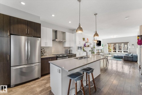 21 Kenton Way, Spruce Grove, AB - Indoor Photo Showing Kitchen With Stainless Steel Kitchen With Double Sink With Upgraded Kitchen