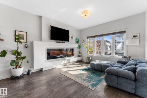 21 Kenton Way, Spruce Grove, AB - Indoor Photo Showing Living Room With Fireplace